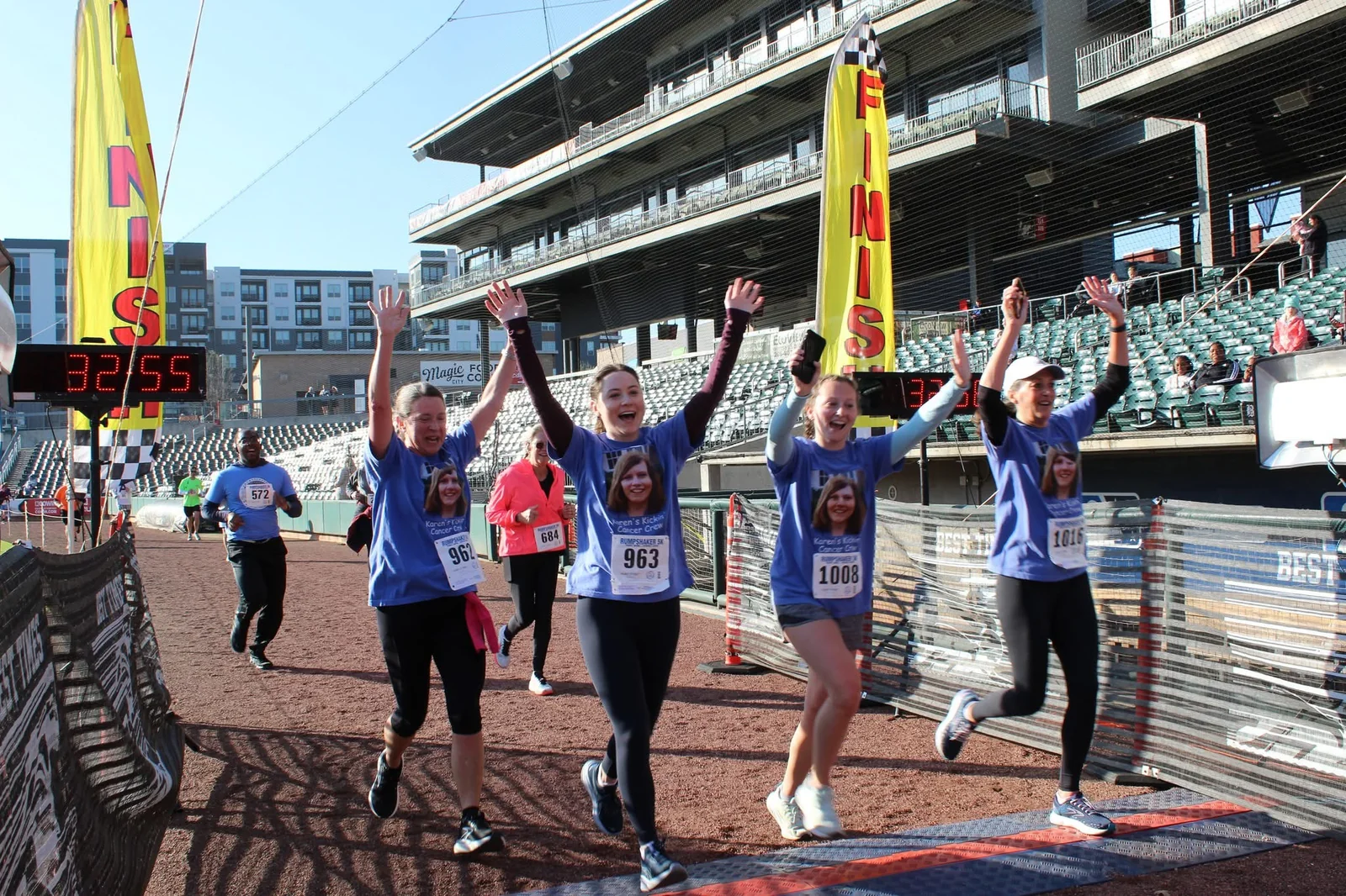 A group of Rumpshaker participants celebrating as they cross the finish line.