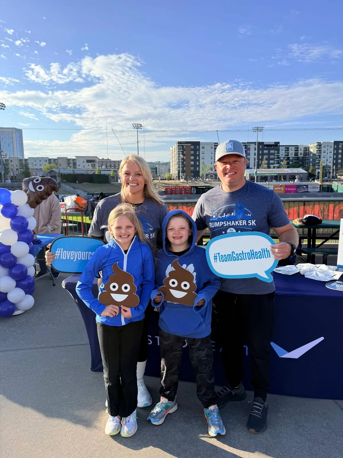 Rumpshaker participants posing with colorectal cancer awareness signs.